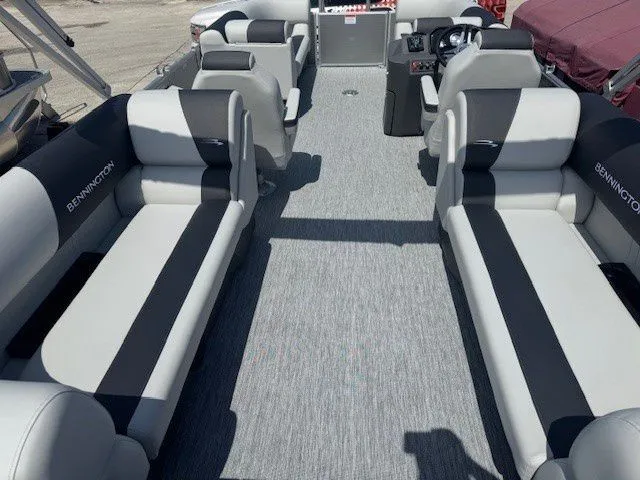 Slide: The Image of Interior of 2026 Bennington 22SSRSE pontoon boat with gray and black seating. - 25