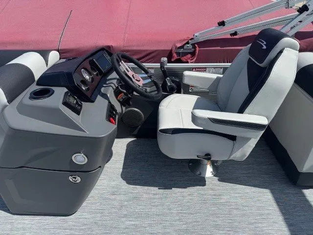 Slide: The Image of Interior of 2026 Bennington 22SSRSE with helm console and seating. - 30