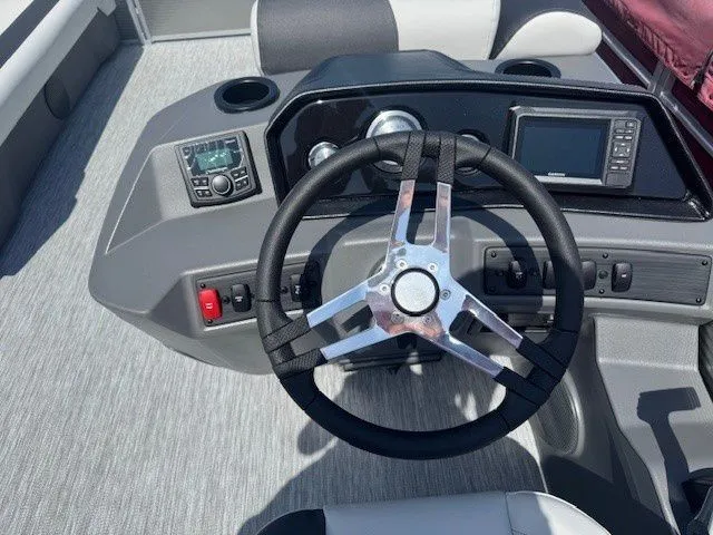 Slide: The Image of Bennington 22SSRSE 2026 helm with modern controls and instruments. - 31