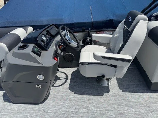 Slide: The Image of 2026 Bennington 22SSRSE interior with helm console and seating. - 34