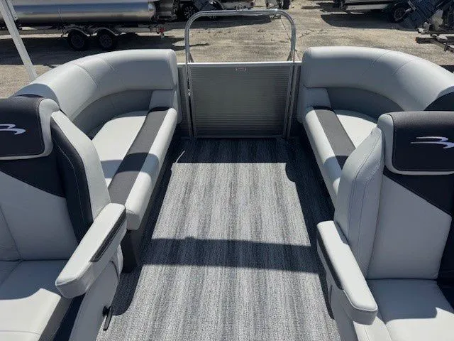 Slide: The Image of Interior of a 2026 Bennington 20SSRSE pontoon boat with gray seating. - 26
