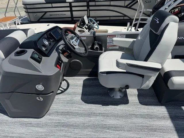 Slide: The Image of Interior of 2026 Bennington 20SSRSE with helm console and captain's chair. - 29
