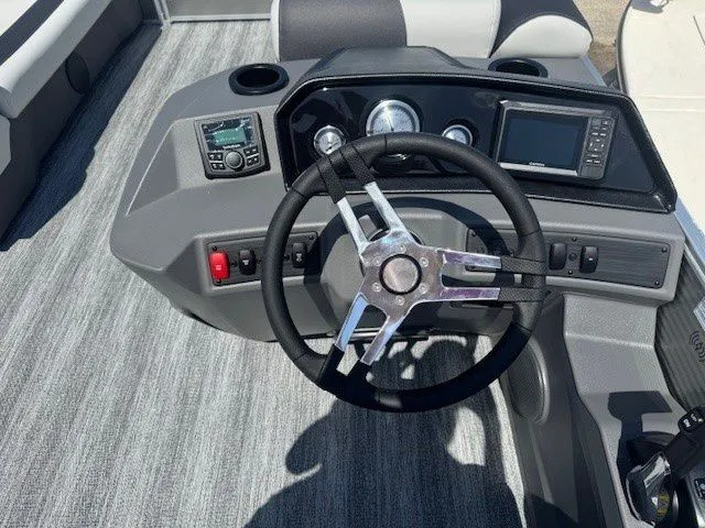 Slide: The Image of Steering wheel and dashboard of a 2026 Bennington 20SSRSE boat. - 30