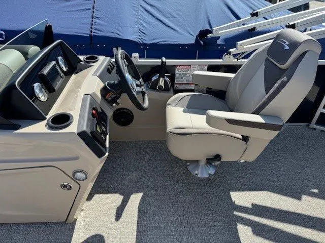 Slide: The Image of Interior of 2026 Bennington 21SL with helm console and captain's chair. - 21