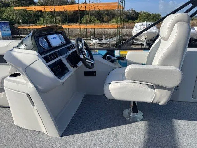 Slide: The Image of Interior of Sweetwater 2286CP boat, 2026 model, featuring helm console and seat. - 26