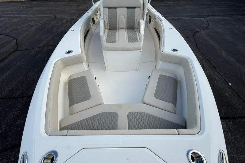 Slide: The Image of 2023 Solace 30 HCS boat interior with cushioned seating and sleek design. - 12