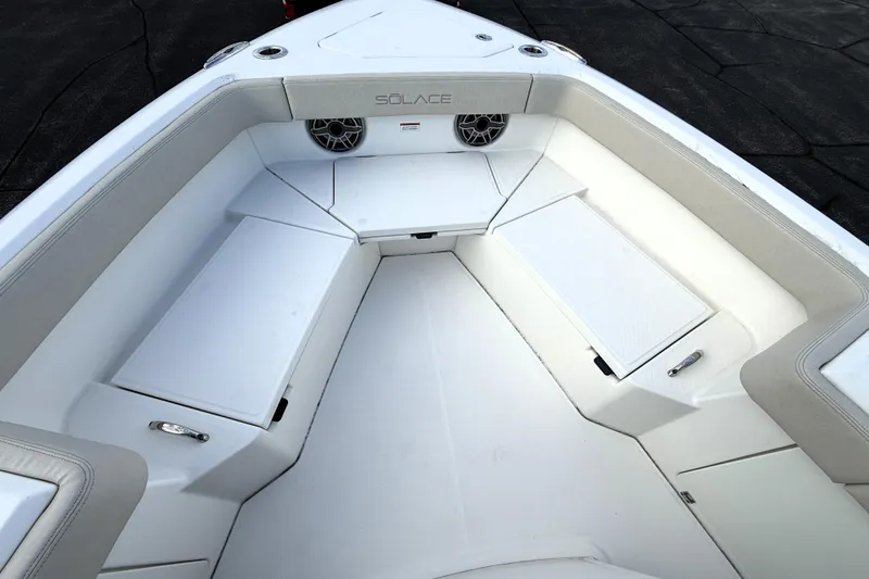Slide: The Image of Interior view of 2023 Solace 30 HCS boat, featuring spacious seating and modern design. - 15