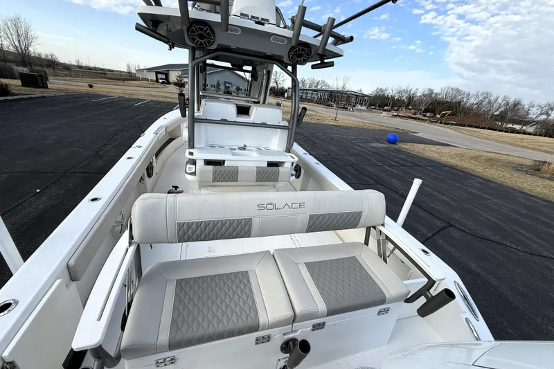 Slide: The Image of 2023 Solace 30 HCS boat interior with cushioned seating and modern design. - 18