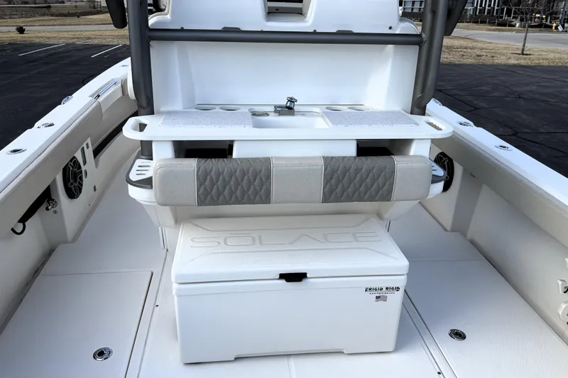 Slide: The Image of 2023 Solace 30 HCS boat interior with seating and storage features. - 21