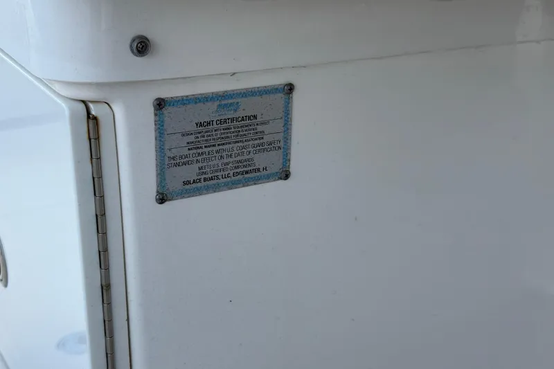Slide: The Image of 2023 Solace 30 HCS yacht certification plaque on white surface. - 29