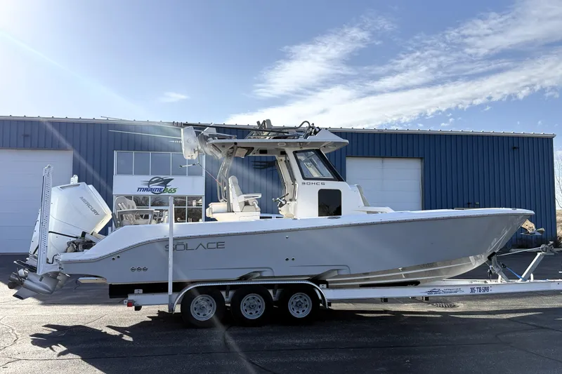 Slide: The Image of 2023 Solace 30 HCS boat on trailer outside Marine 365 building. - 3