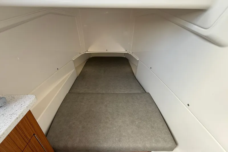 Slide: The Image of 2023 Solace 30 HCS cabin interior with cushioned sleeping area. - 36