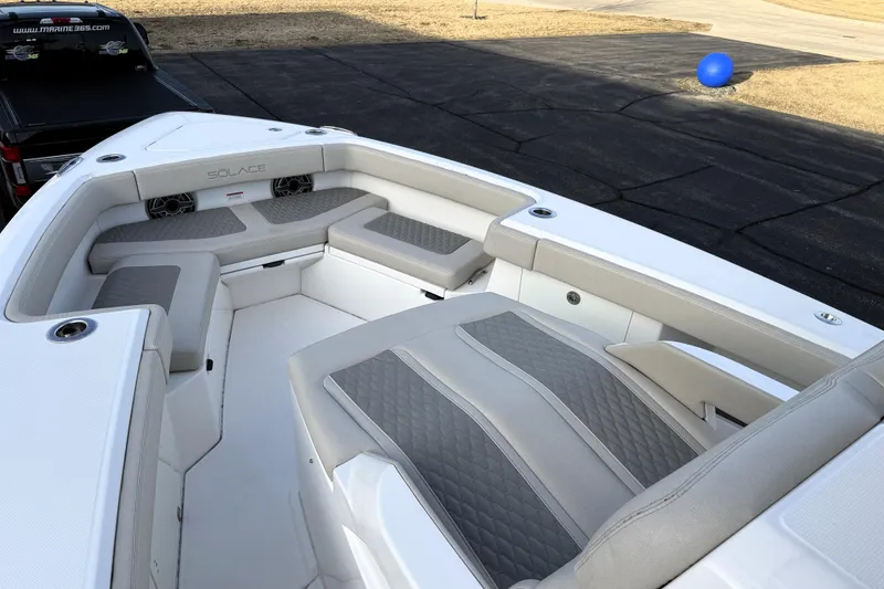 Slide: The Image of 2023 Solace 30 HCS boat interior with cushioned seating and sleek design. - 40