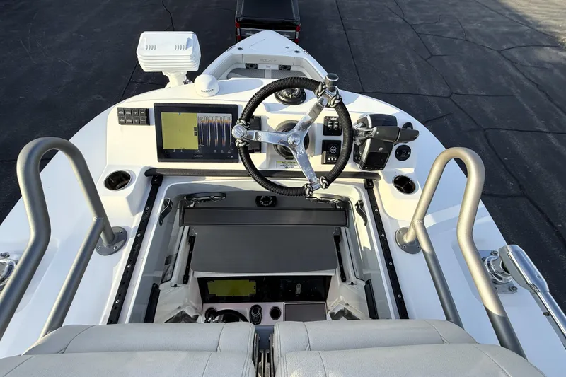 Slide: The Image of 2023 Solace 30 HCS boat helm with advanced navigation system and controls. - 42
