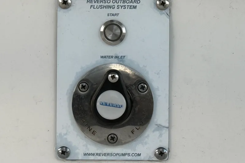 Slide: The Image of Reverso outboard flushing system on 2023 Solace 30 HCS boat. - 59