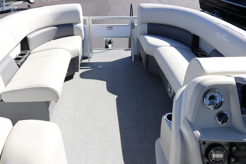 Slide: The Image of 2023 SunChaser Vista 20 Fish pontoon boat interior with plush seating and modern dashboard. - 10