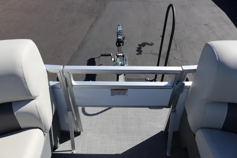 Slide: The Image of 2023 SunChaser Vista 20 Fish pontoon boat interior with plush seating and trailer hitch. - 11