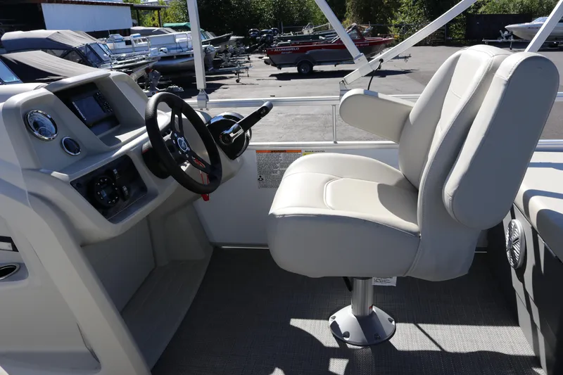 Slide: The Image of Captain's seat and helm of 2023 SunChaser Vista 20 Fish boat. - 18