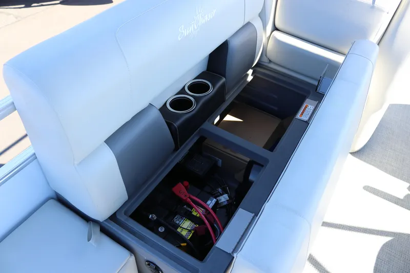 Slide: The Image of 2023 SunChaser Vista 20 Fish boat seat storage with cup holders and battery compartment. - 24