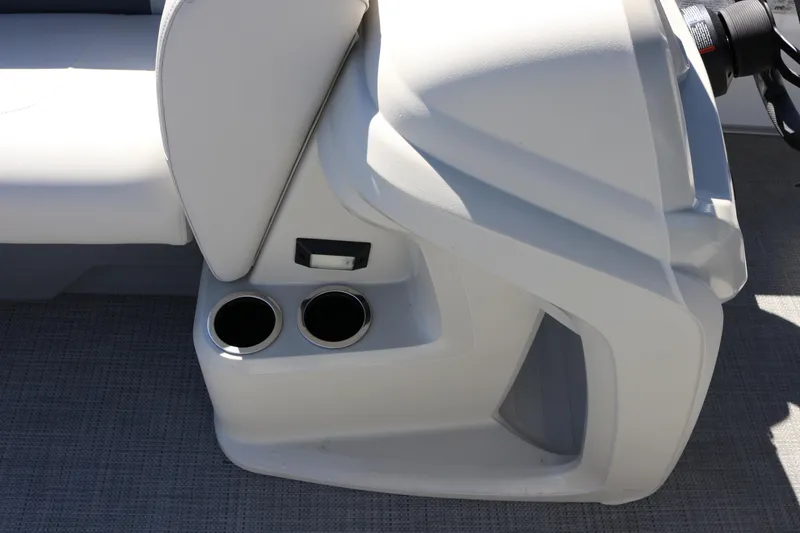 Slide: The Image of 2023 SunChaser Vista 20 Fish boat interior with cup holders and seating detail. - 25