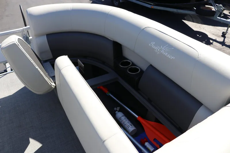 Slide: The Image of 2023 SunChaser Vista 20 Fish boat interior with storage compartment and cup holders. - 29