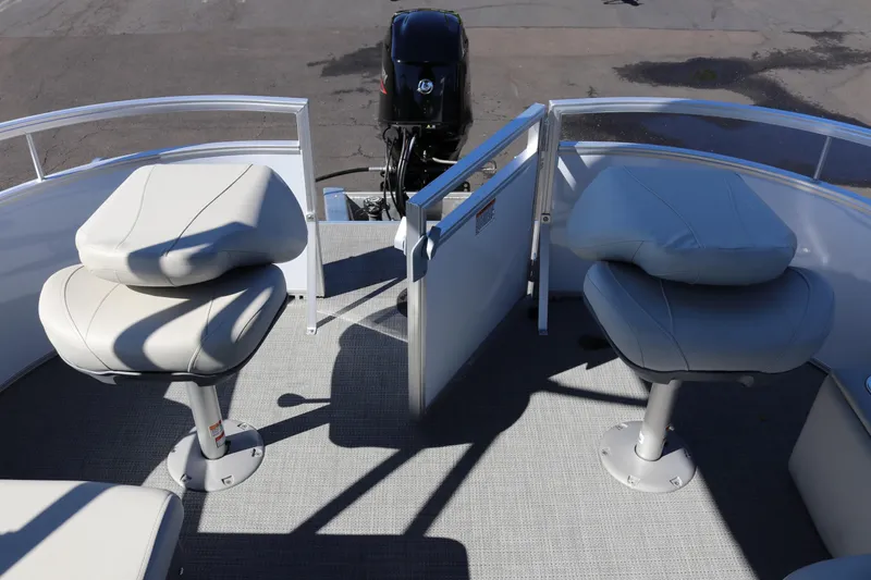 Slide: The Image of 2023 SunChaser Vista 20 Fish boat interior with two swivel seats and motor. - 33