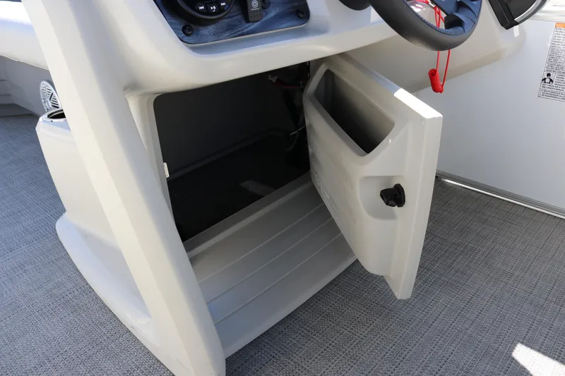 Slide: The Image of Open storage compartment on 2023 SunChaser Vista 20 Fish boat console. - 34