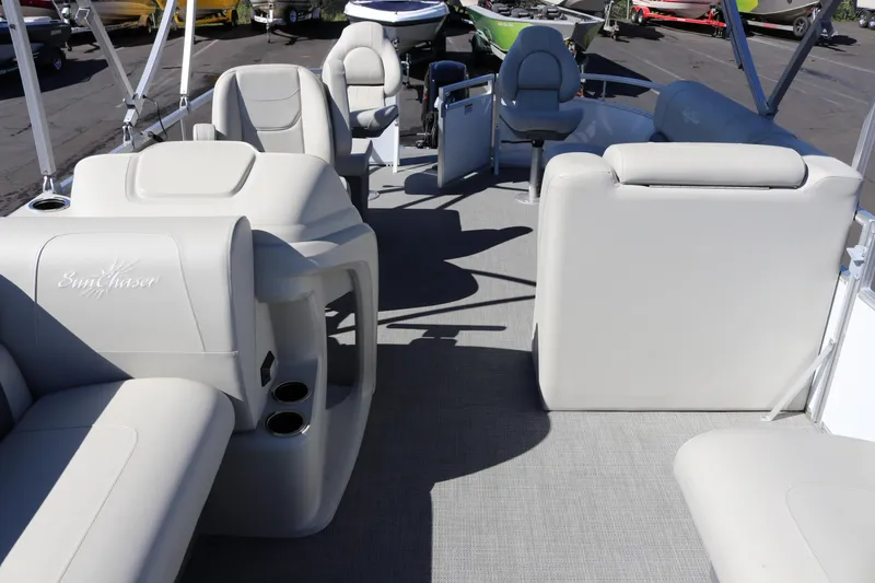 Slide: The Image of 2023 SunChaser Vista 20 Fish pontoon boat interior with plush seating and cup holders. - 36