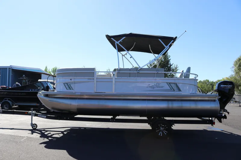 Slide: The Image of 2023 SunChaser Vista 20 Fish pontoon boat with canopy on trailer. - 4