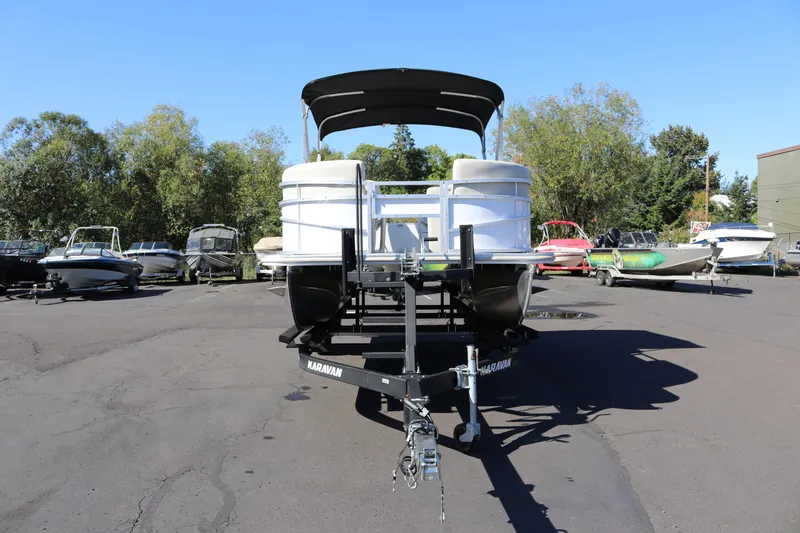 Slide: The Image of 2023 SunChaser Vista 20 Fish pontoon boat on trailer in outdoor lot. - 6