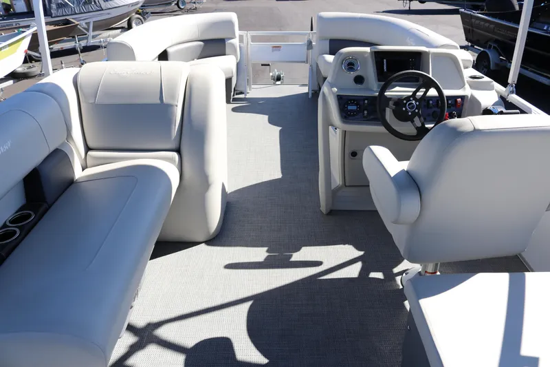 Slide: The Image of 2023 SunChaser Vista 20 Fish pontoon boat interior with plush seating and modern helm. - 8
