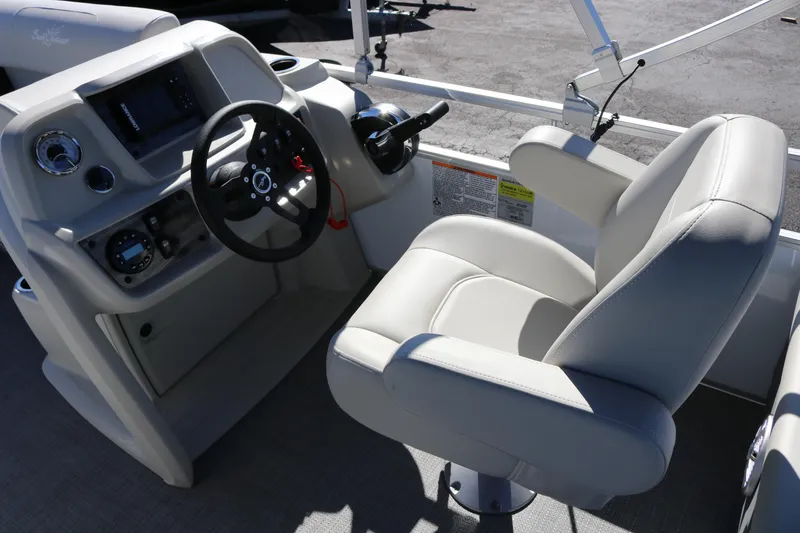 Slide: The Image of 2023 SunChaser Vista 20 Fish boat interior with steering wheel and captain's chair. - 9