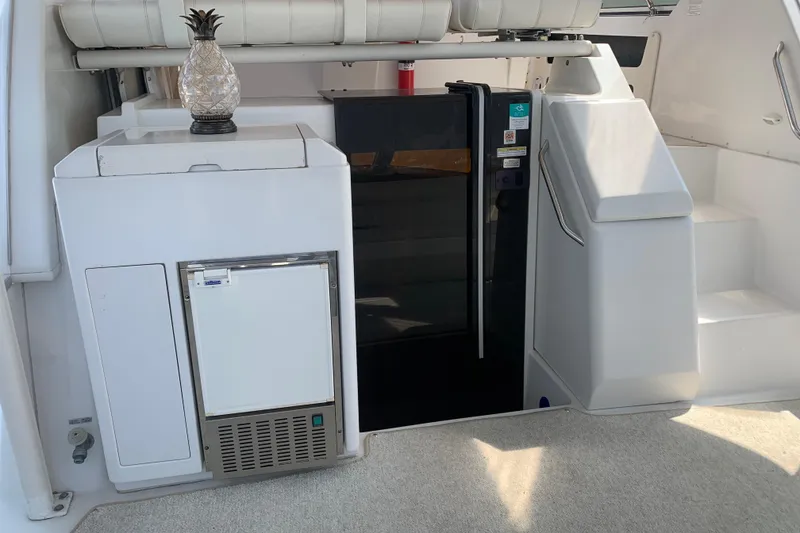 Slide: The Image of Interior of 2000 Carver 356 Aft Cabin Motor Yacht with fridge and stairs. - 14