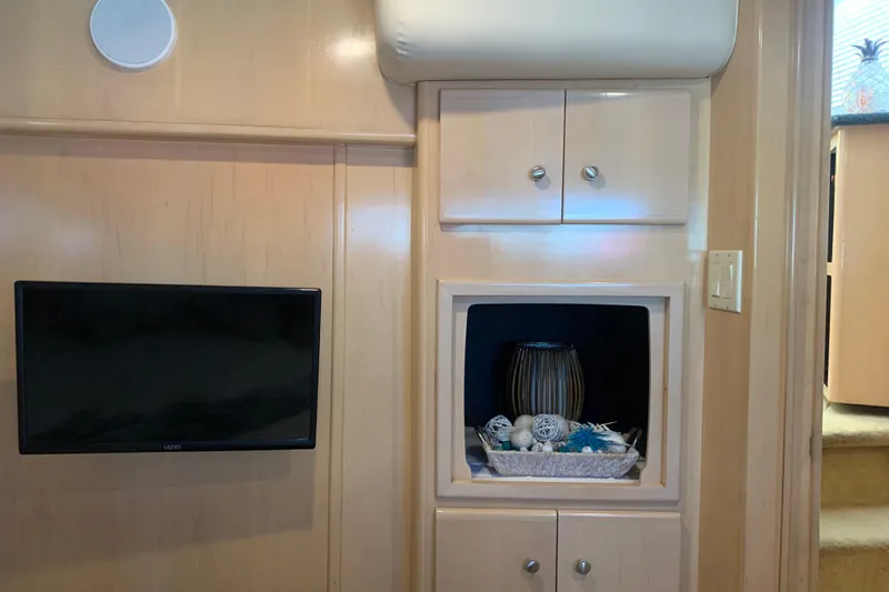 Slide: The Image of Interior of 2000 Carver 356 Aft Cabin Motor Yacht with TV and decorative shelf. - 15
