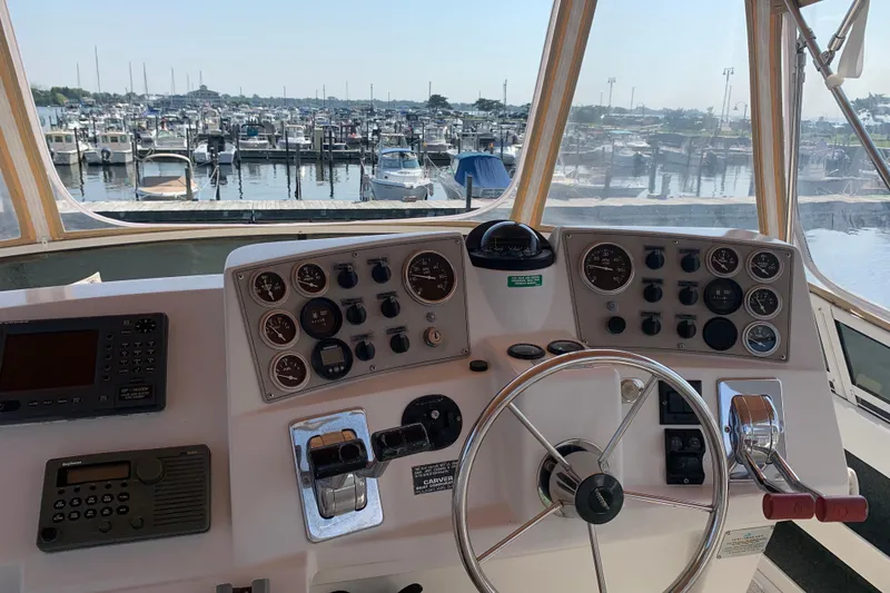 Slide: The Image of Helm of 2000 Carver 356 Aft Cabin Motor Yacht with marina view. - 17