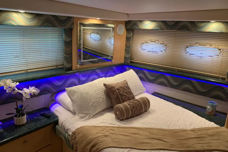 Slide: The Image of Luxurious bedroom interior of 2000 Carver 356 Aft Cabin Motor Yacht with elegant decor. - 21