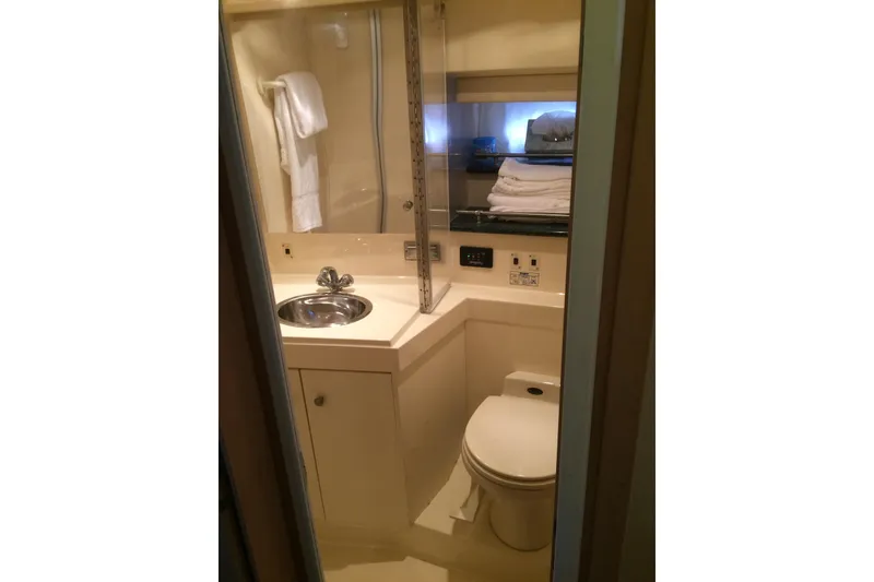 Slide: The Image of Bathroom interior of 2000 Carver 356 Aft Cabin Motor Yacht, featuring sink and toilet. - 25