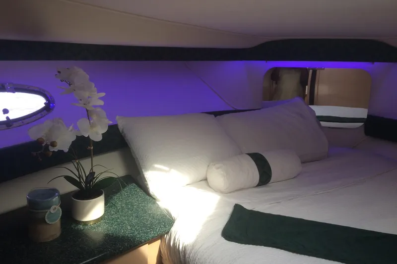 Slide: The Image of Cozy cabin interior of 2000 Carver 356 Aft Cabin Motor Yacht with elegant bedding and decor. - 27