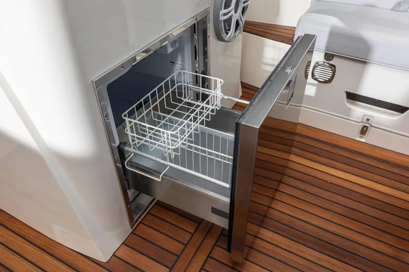Slide: The Image of Open drawer refrigerator on 2025 Nuova Jolly Prince 38 Sport Cabin boat, featuring teak flooring. - 10