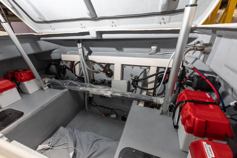 Slide: The Image of Engine compartment of 2025 Nuova Jolly Prince 38 Sport Cabin with red battery covers. - 11