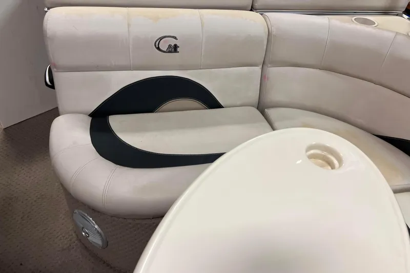 Slide: The Image of 2014 Avalon Grand Island 2485 QF boat interior with white and black seating. - 21