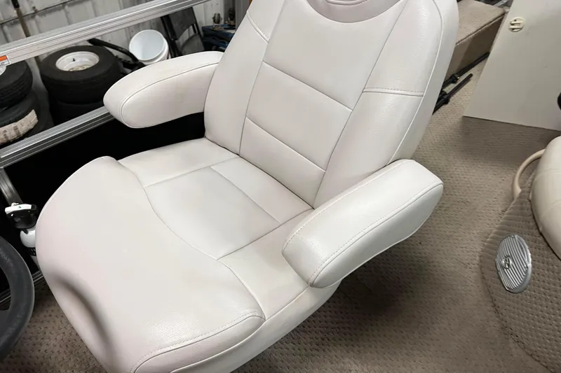 Slide: The Image of White captain's chair in 2014 Avalon Grand Island 2485 QF boat interior. - 25