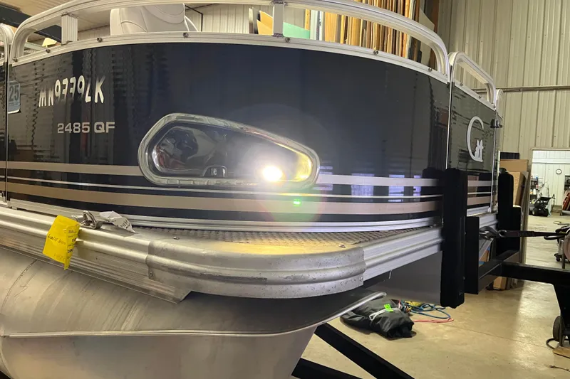 Slide: The Image of 2014 Avalon Grand Island 2485 QF pontoon boat in a storage facility. - 3