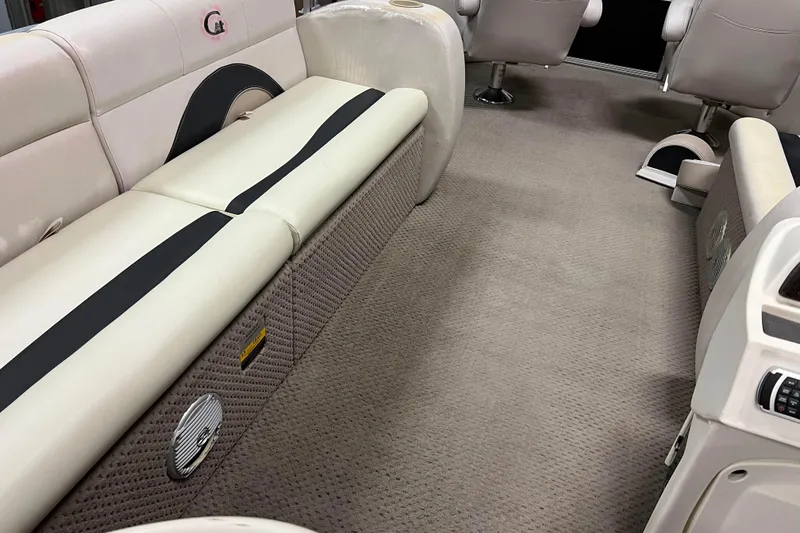 Slide: The Image of 2014 Avalon Grand Island 2485 QF interior with beige seating and carpeted flooring. - 40