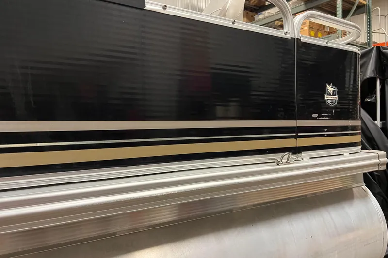 Slide: The Image of 2014 Avalon Grand Island 2485 QF pontoon boat with sleek black and silver design. - 41