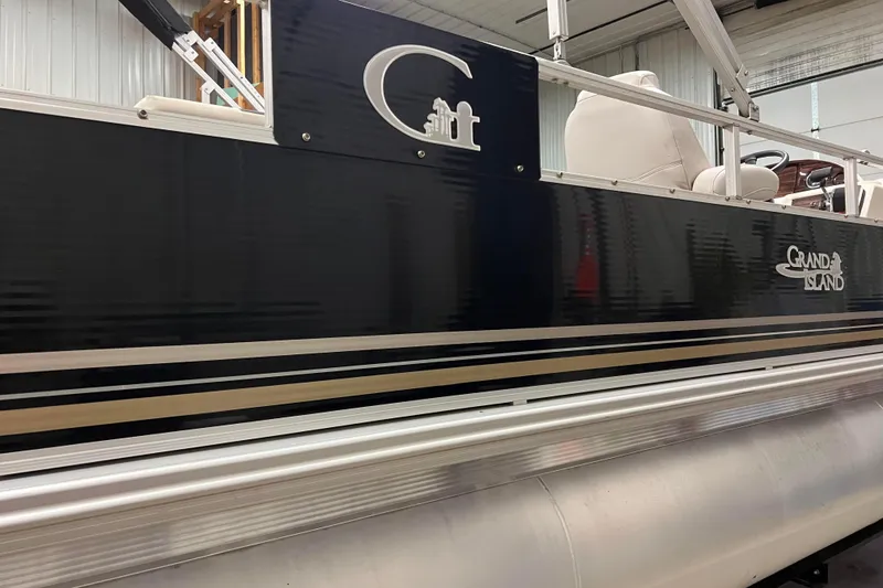 Slide: The Image of 2014 Avalon Grand Island 2485 QF pontoon boat in a showroom setting. - 42