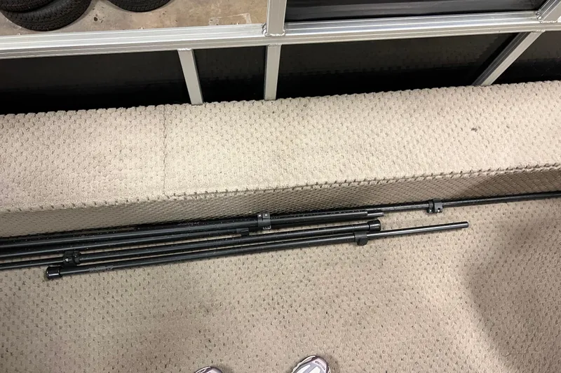 Slide: The Image of 2014 Avalon Grand Island 2485 QF interior with beige upholstery and black metal rods. - 57