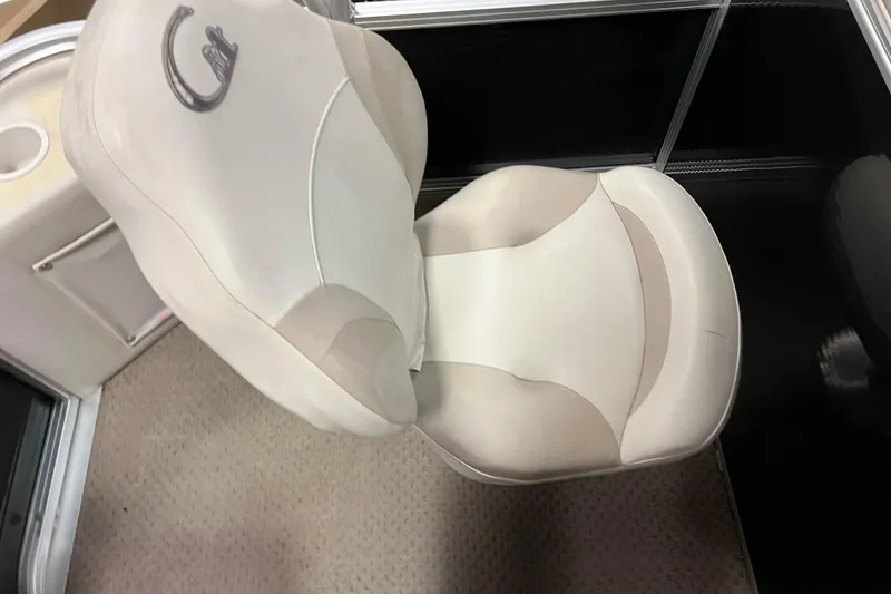 Slide: The Image of 2014 Avalon Grand Island 2485 QF boat seat, beige upholstery, carpeted floor. - 61