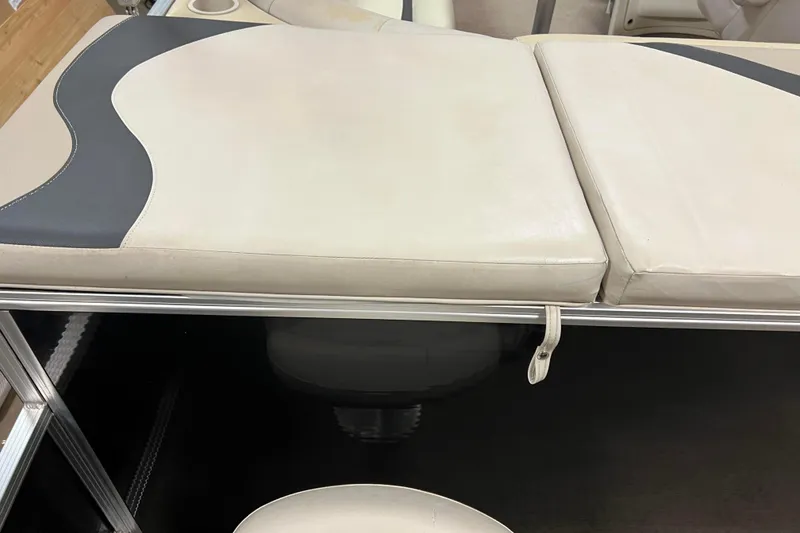 Slide: The Image of 2014 Avalon Grand Island 2485 QF boat seat with beige and black upholstery. - 63