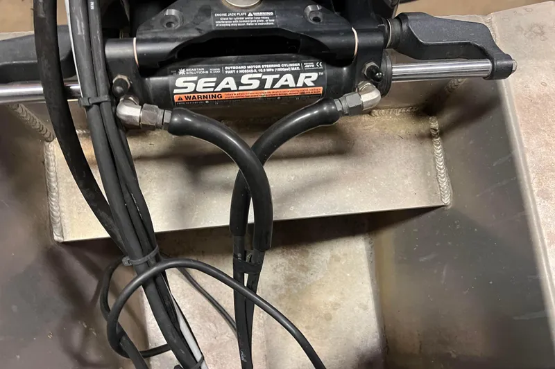 Slide: The Image of Close-up of SeaStar hydraulic steering system on 2014 Avalon Grand Island 2485 QF boat. - 73